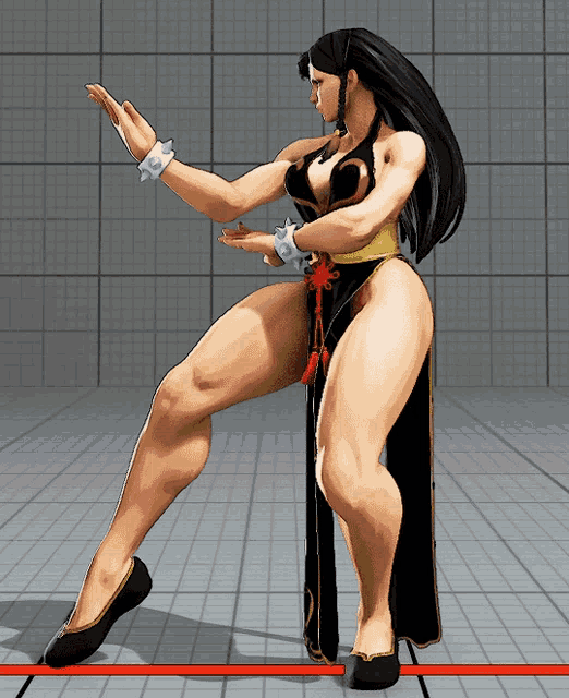 a woman in a black dress is doing a karate pose