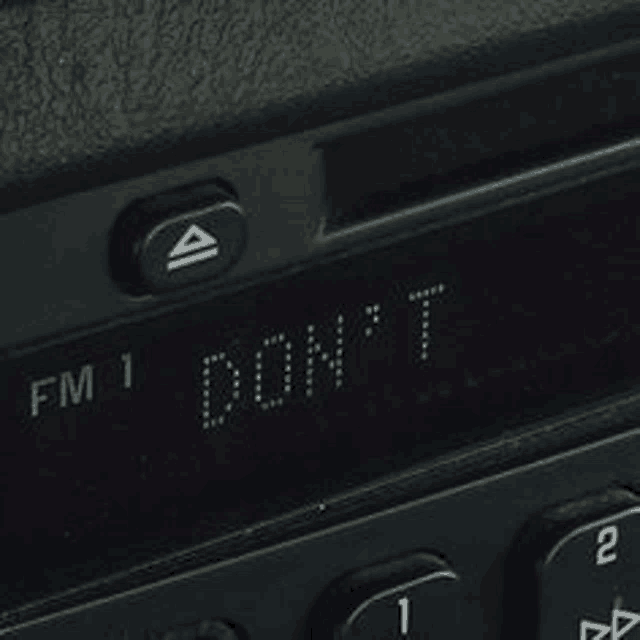 a close up of a radio with the words `` fm 1 don 't '' on it .