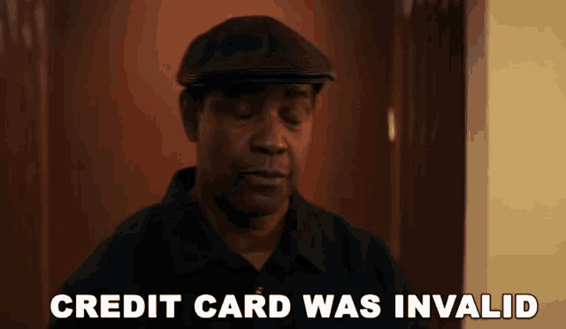 a man in a hat says credit card was invalid in front of a door