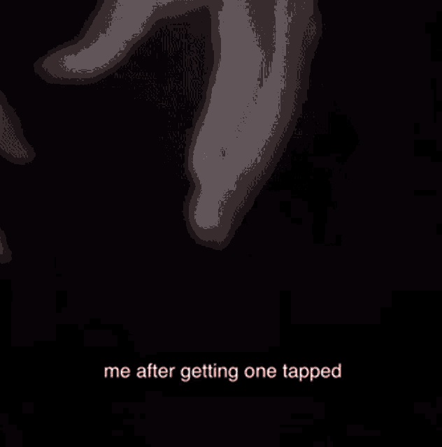 a close up of a person 's face with a caption that says " me after getting one tapped "