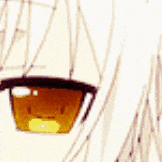 a close up of a girl 's eye with a yellow pupil .