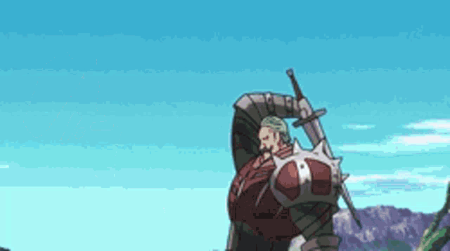a man in armor is holding a sword and shield in his hands .