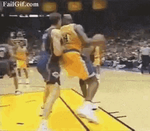 a basketball player with the number 13 on his jersey tries to block another player