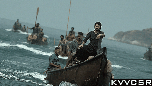 a group of men are in a boat in the ocean with the letters kwvcsr above them