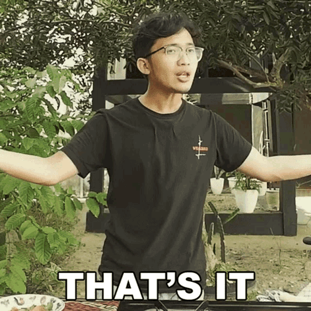 a young man wearing glasses and a black shirt says " that 's it "