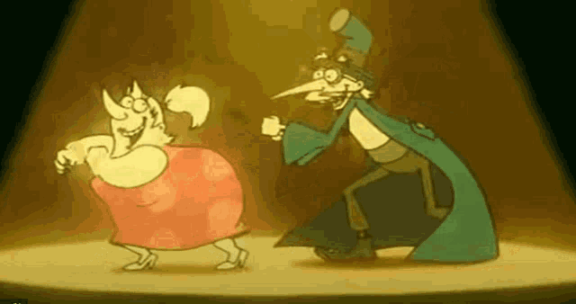 a man and a woman are dancing on a stage .