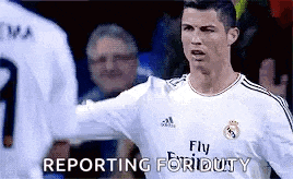 a soccer player wearing a fly emirates shirt is reporting for duty .