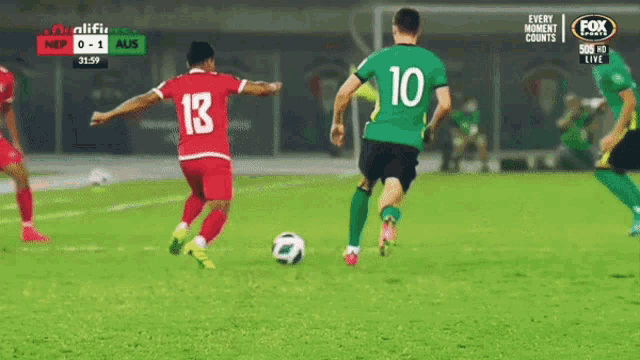 soccer players on a field with a fox sports logo in the corner