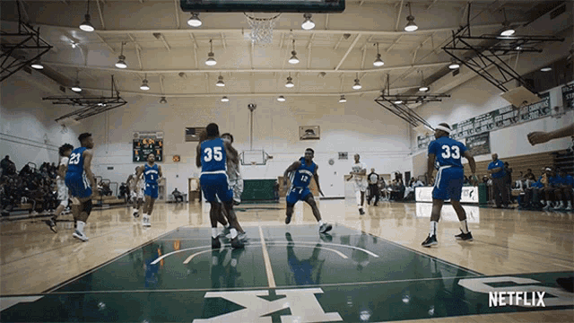 a basketball game is being played in a gym with a netflix logo