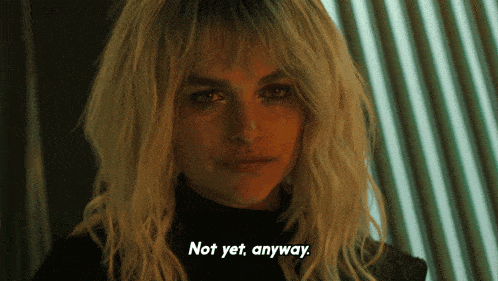 a woman says not yet anyway in a dark room