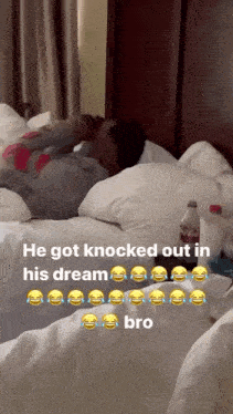 a bottle of coca cola sits on a bed next to a person