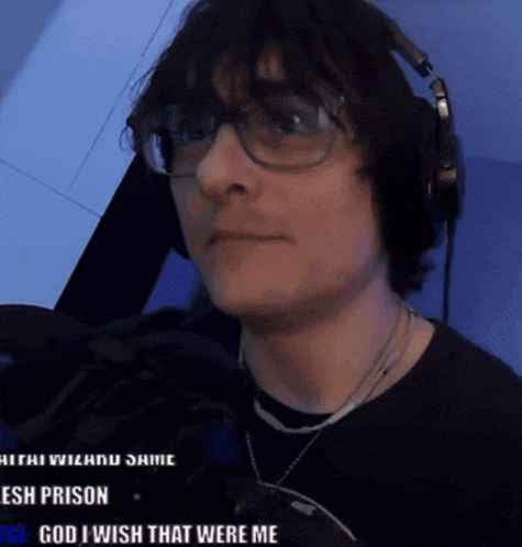 a man wearing glasses and headphones with the words god i wish that were me on the bottom