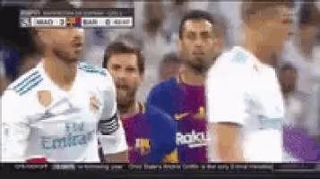 a group of soccer players are standing next to each other on a television screen .