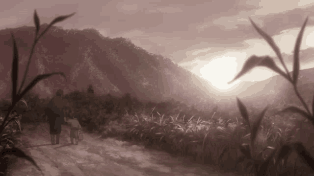 a woman and child are walking down a dirt road in a field at sunset .