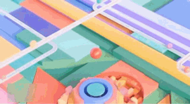 a close up of a colorful marble run with balls going down a track .