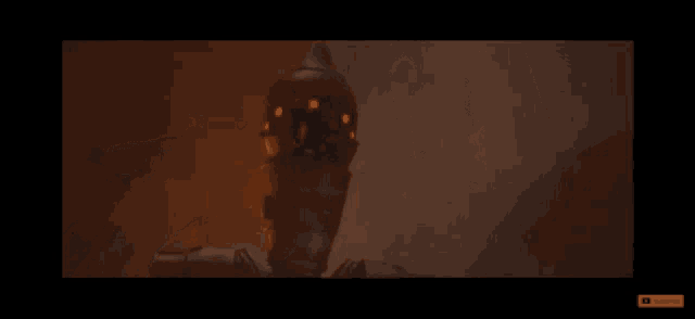 a robot with red lights on its eyes is standing in a dark room