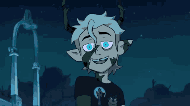 a cartoon character with horns and a cat on his shirt is smiling