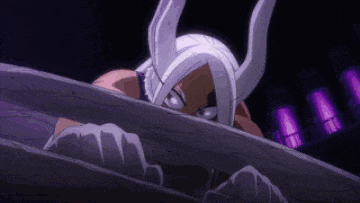 a woman with bunny ears is peeking out from behind a fence in a dark room .