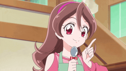 a girl in an apron holds a spoon in her hand