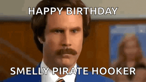 a man with a mustache is wearing a blue suit and tie with the caption happy birthday smelly pirate hooker