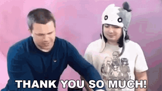 a man and a woman are standing next to each other and the woman is wearing a cat hat and says `` thank you so much ''
