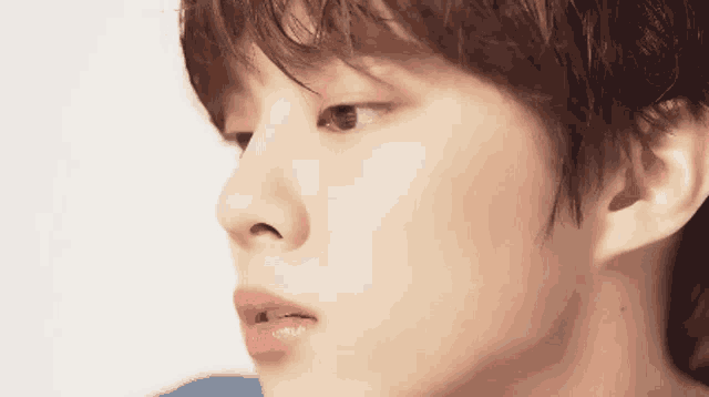 a close up of a person 's face with a white background