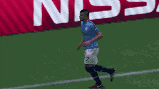 a soccer player with the number 2 on his shorts