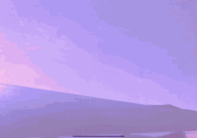 a purple sky is behind a purple umbrella
