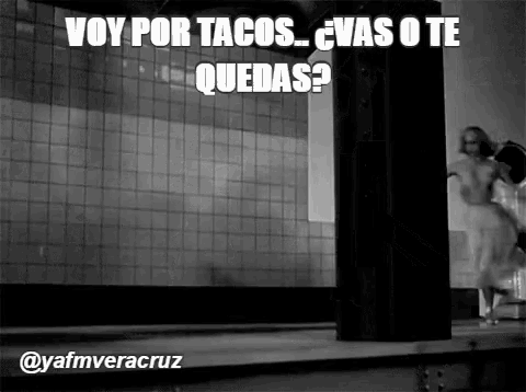 a black and white photo with a caption that says voy por tacos vas o te quedas