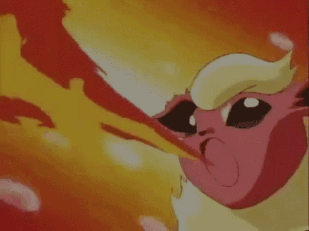 a close up of a cartoon character with a flame coming out of its mouth .