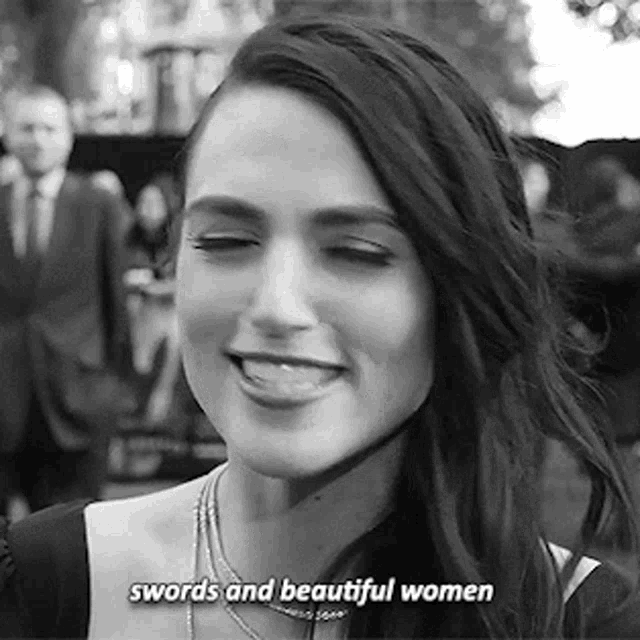 a woman is smiling in a black and white photo with the words swords and beautiful women .