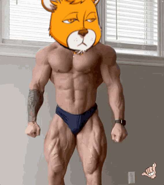 a bodybuilder with a cartoon bear head on his chest