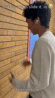 a man is standing in front of a brick wall with the words shut up and is slide it in bottom text