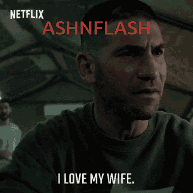a man with a fist in the air and the words i love my wife