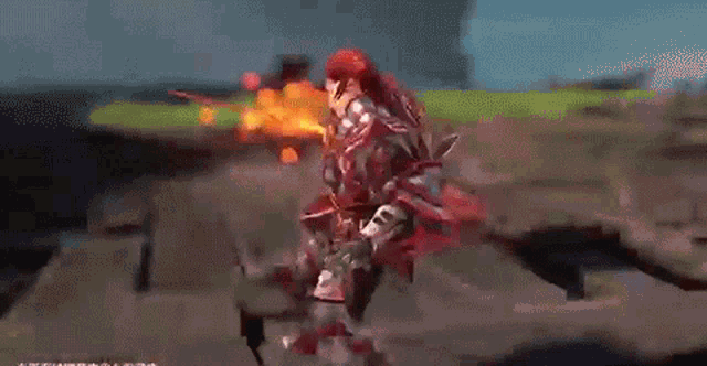 a video game character is holding a sword in front of a fireball .