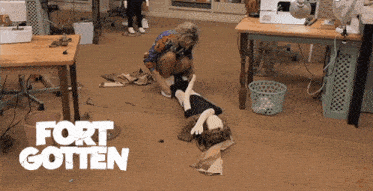 a woman is kneeling down next to a doll and the words fort gotten are on the floor
