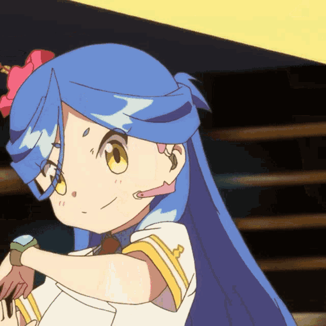 a cartoon character with blue hair and yellow eyes is smiling