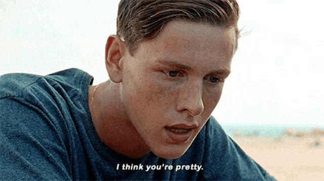 a young man says i think you 're pretty in a blue shirt