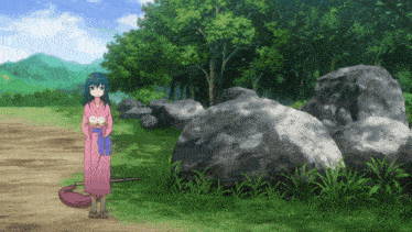 a girl in a pink kimono stands in a grassy field