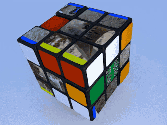 a rubik 's cube with a picture of a mountain on the side