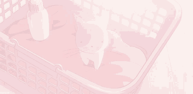 a pink laundry basket with a cat and a bottle of lotion