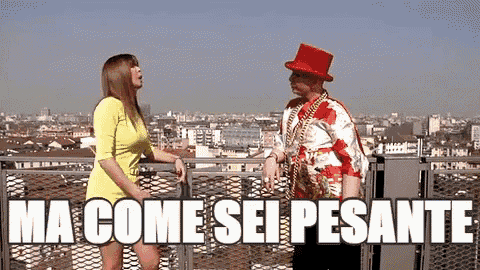 a man in a red top hat is standing next to a woman on a balcony and the words ma come sei pesante are above them