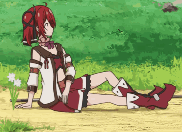 a girl with red hair sits on a dirt road