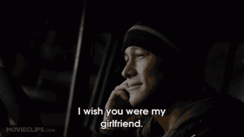 a man talking on a cell phone with the words " i wish you were my girlfriend "