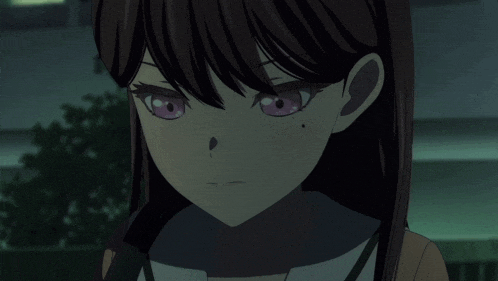 a close up of a girl 's face with pink eyes