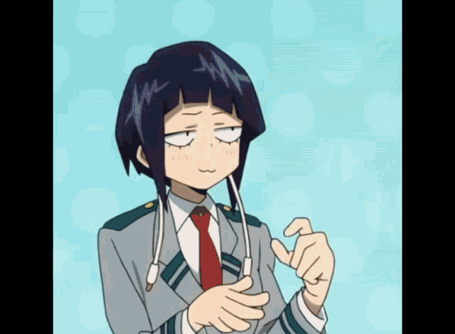 a girl in a suit and tie is making a funny face with her eyes closed