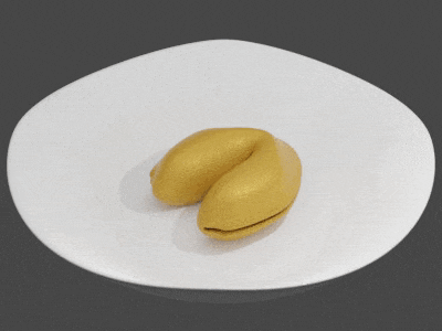 a gold fortune cookie with arabic writing on it sits on a white surface