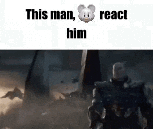 a man in a suit with a mouse on his face is standing in front of a giant monster .