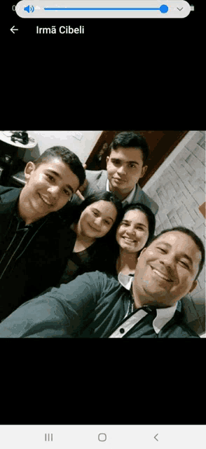 a group of people posing for a selfie with the name irma cibeli on the bottom