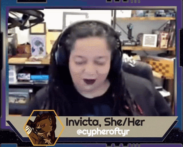 a woman wearing headphones with the name invicta on the screen